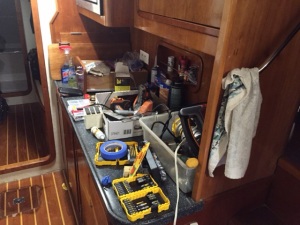 Damaged flooring locker appears to the left of the photo along with tools